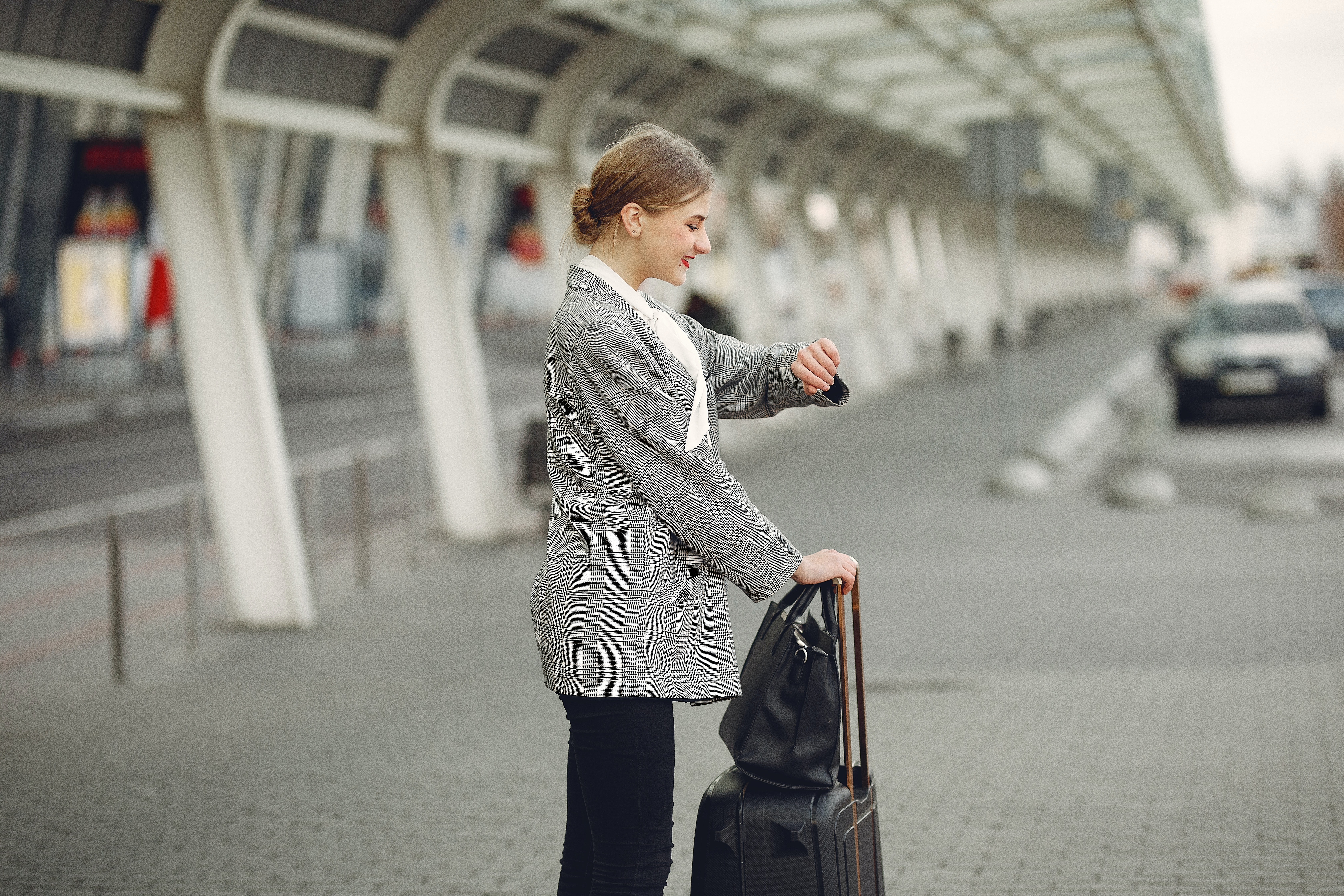 Lady waiting for a taxi at the airport