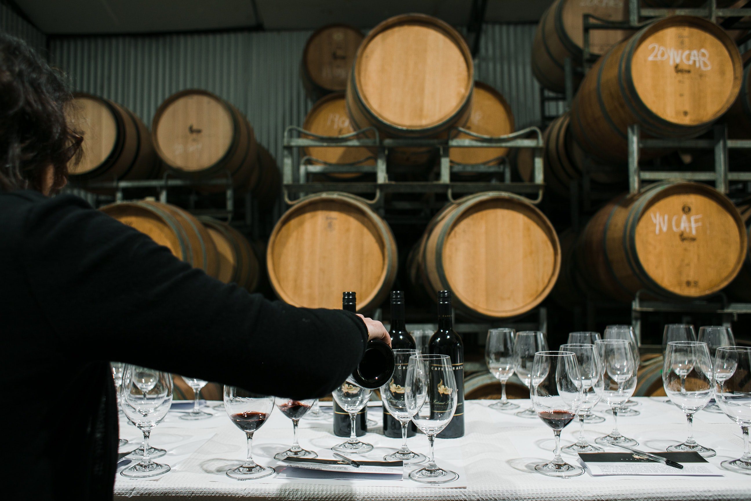 Lady pouring wine in a glass