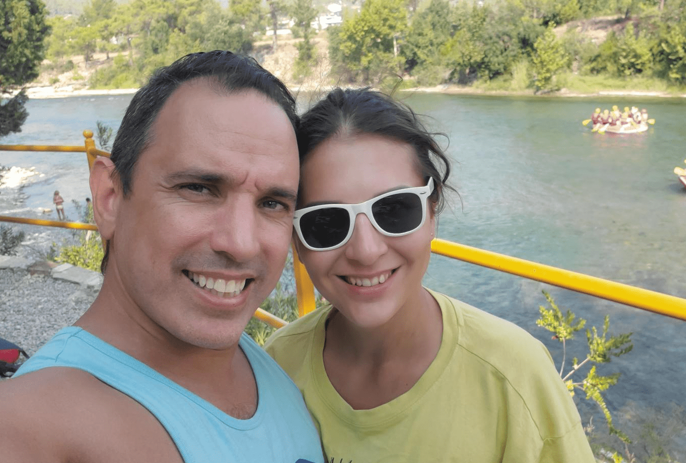 Greg Moreno posing near a river