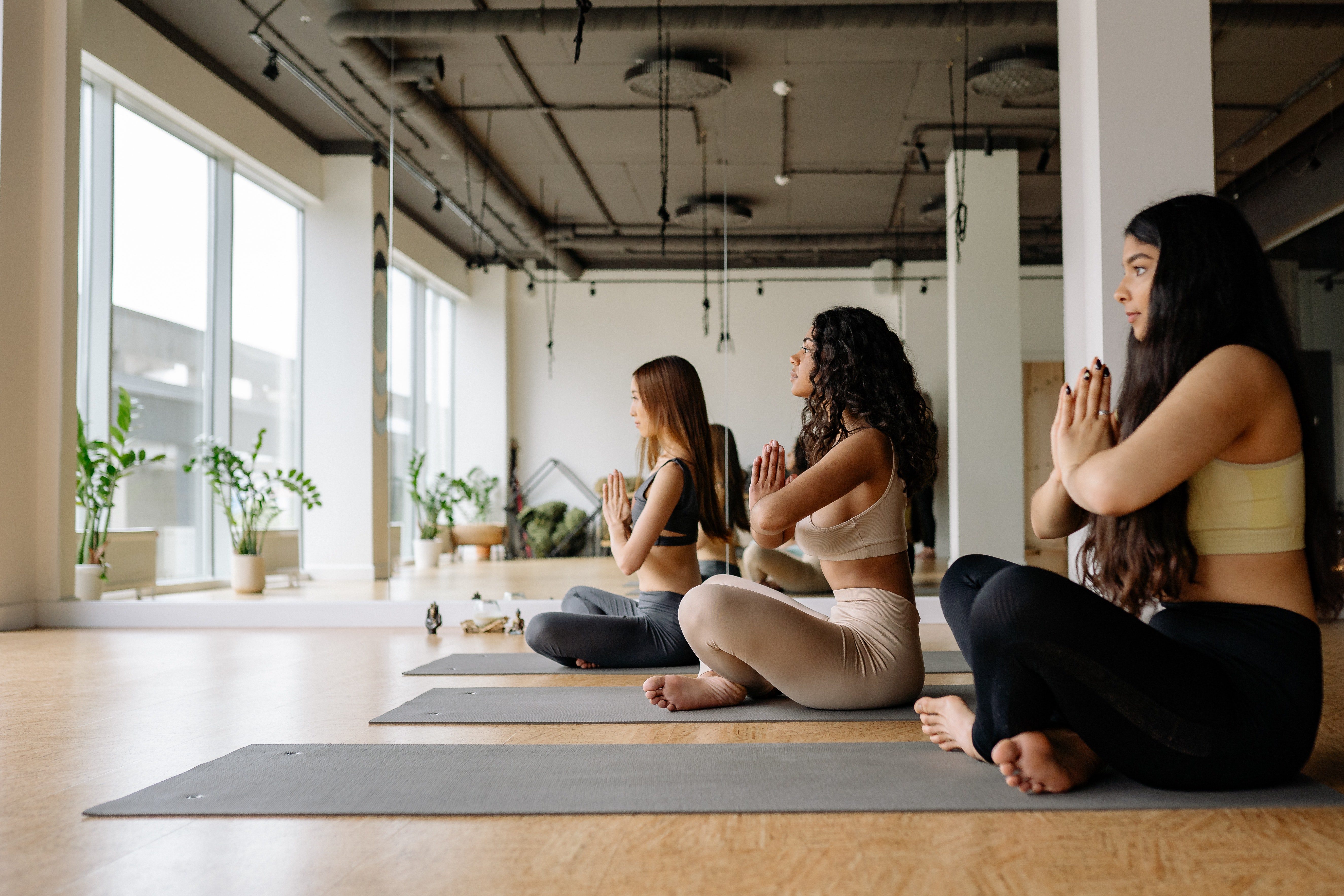 Ladies doing a pose in yoga