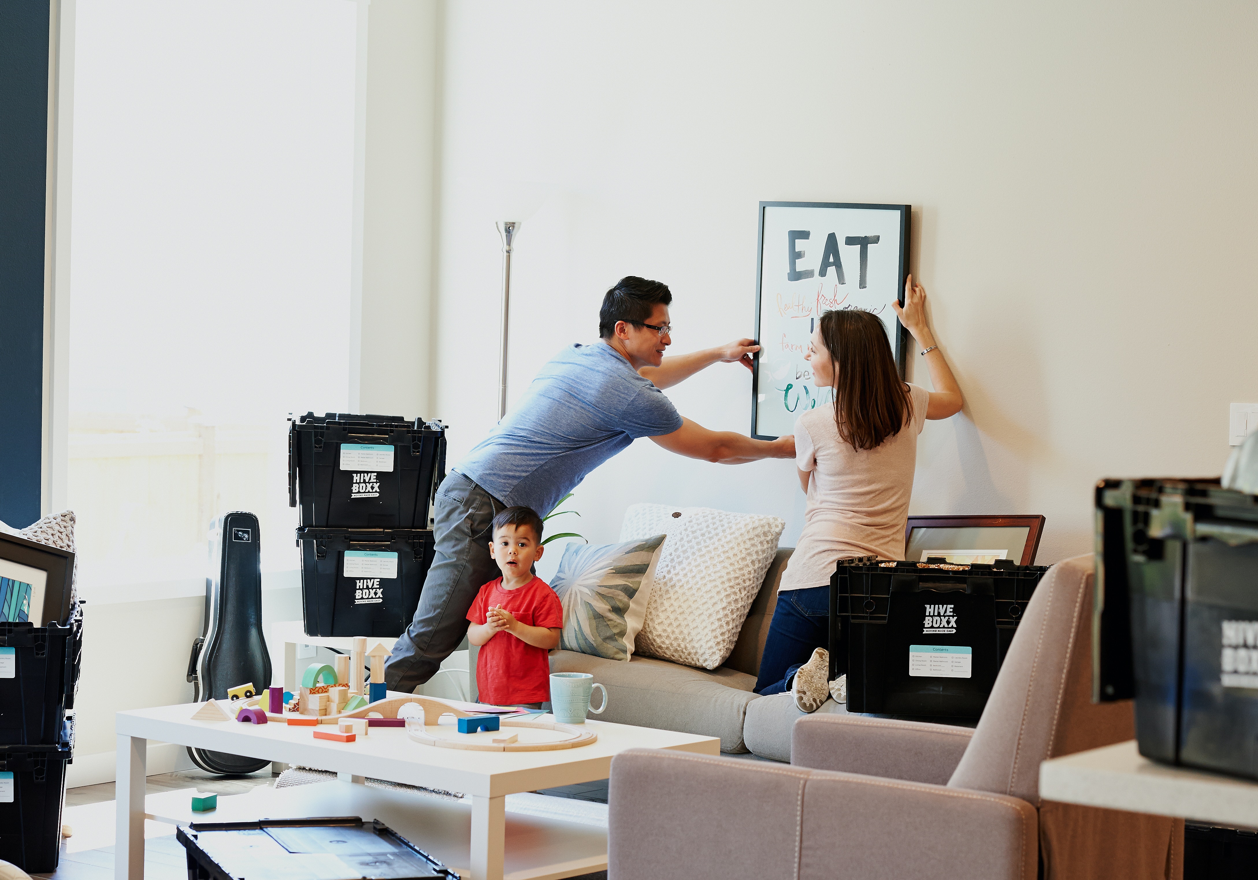 couple and child moving into a new home